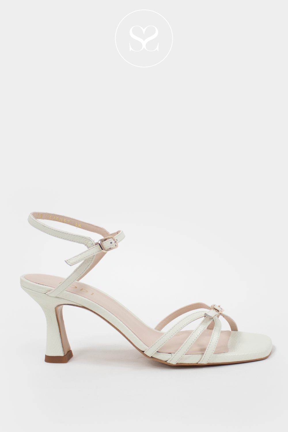 Lodi Luki cream leather strappy mid heel sandals. Gladiator style. Adjustabla ankle strap. Sculpted heel with wider base for stability. Gold buckle. Gel cushioned insole.