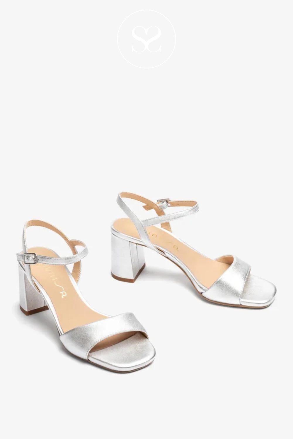 Silver high-heeled sandals on a white background from Unisa available in Ireland
