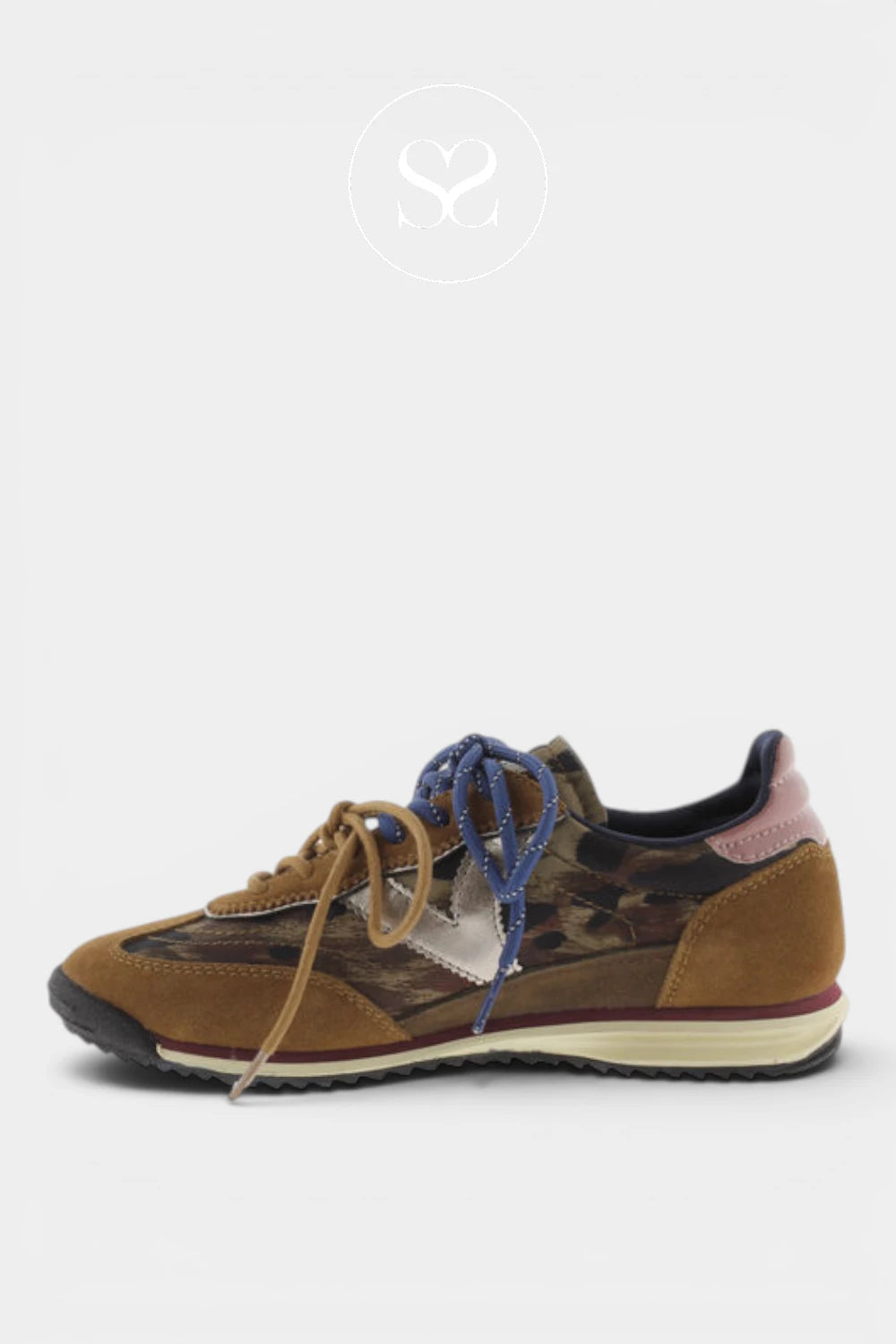 A low-top sneaker shown in profile against a light gray background. The shoe features a brown suede and camouflage pattern upper, blue laces, a cream midsole, and a black outsole.