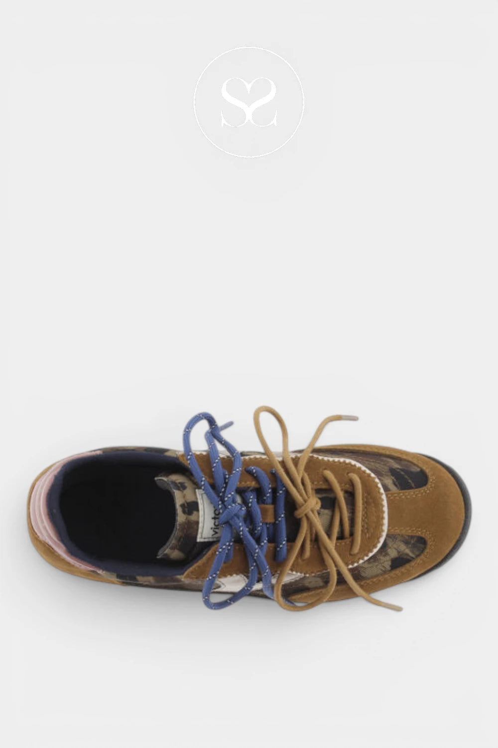 A single low-top sneaker shown from a top-down view on a light gray background. The shoe features a brown suede upper with a dark camouflage pattern on the toe and heel, tan laces, and contrasting blue laces.