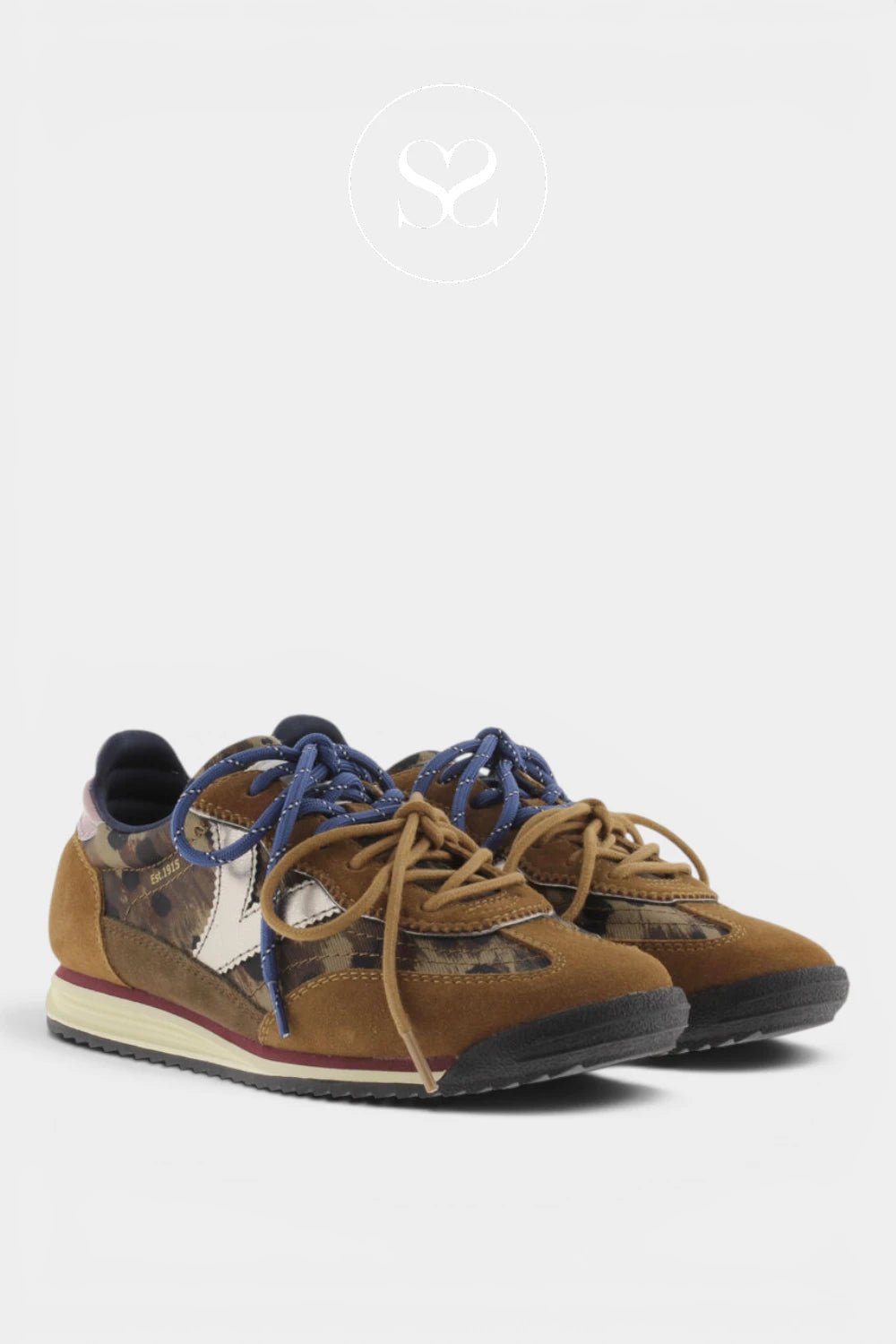 A pair of low-top sneakers in brown suede and camouflage print, featuring blue laces, a white star detail on the side, and a black sole, set against a light gray background.