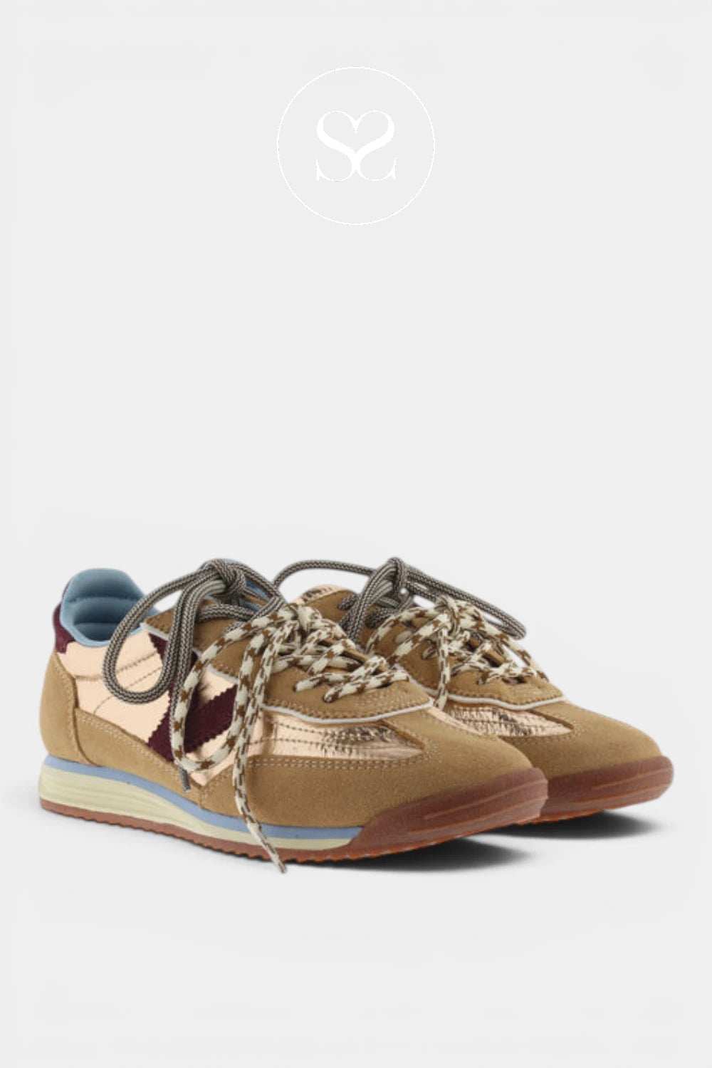 A pair of low-top sneakers in beige suede and metallic gold fabric, featuring chunky woven brown and beige laces, a light blue heel tab, and a gum sole, shown against a light gray background.