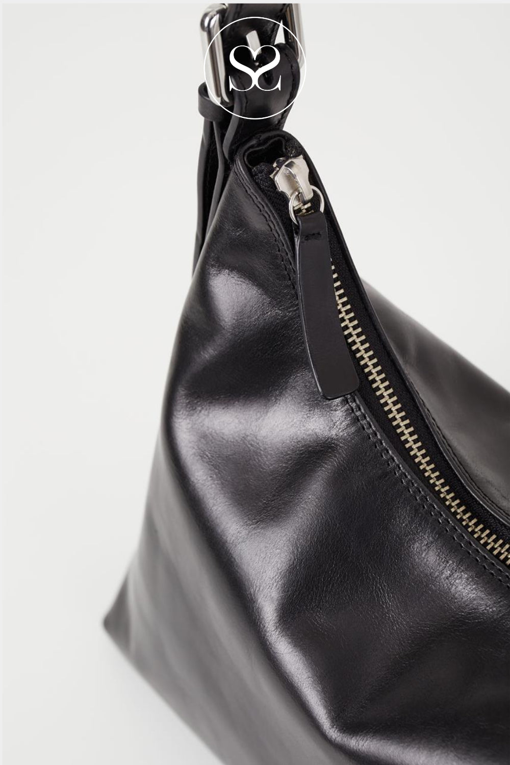 Black leather shoulder bag with a zipper closure
