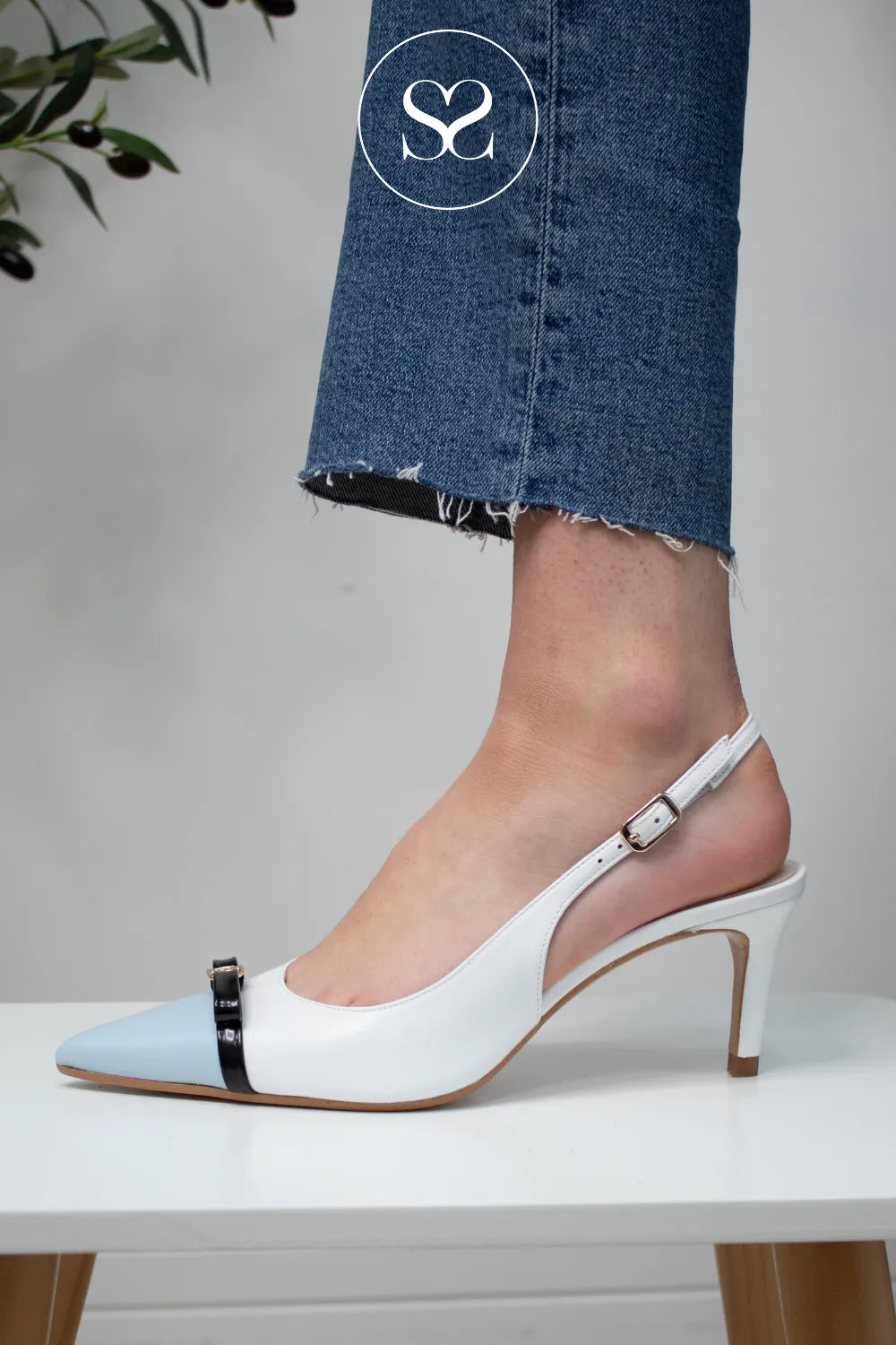 LODI White and blue Slingback Heels - NUREIA Chic two-tone design combining soft white leather and blue pointed toe detail.