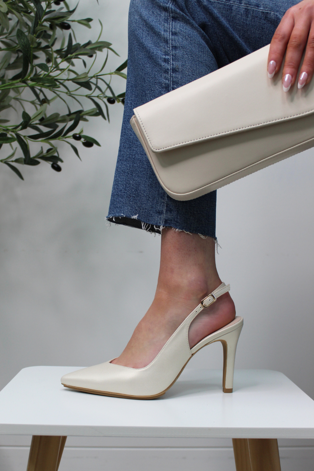 Lodi high heel slingback heels in a cream champagne colour with an adjustable ankle strap