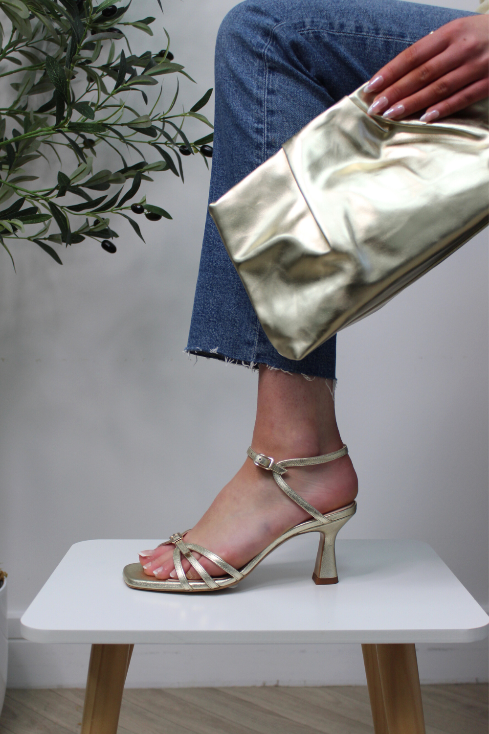 Lodi gold gladiator mid height heels