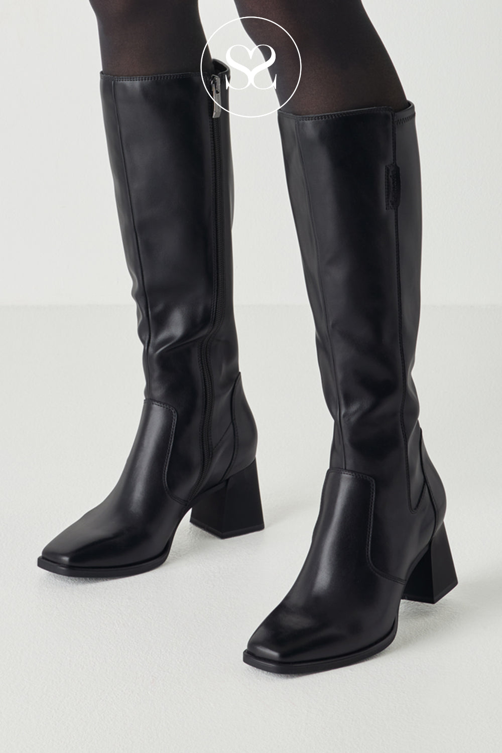 Black leather long boots with a clean fitted leg, side zip detail and wearable mid-height heel.