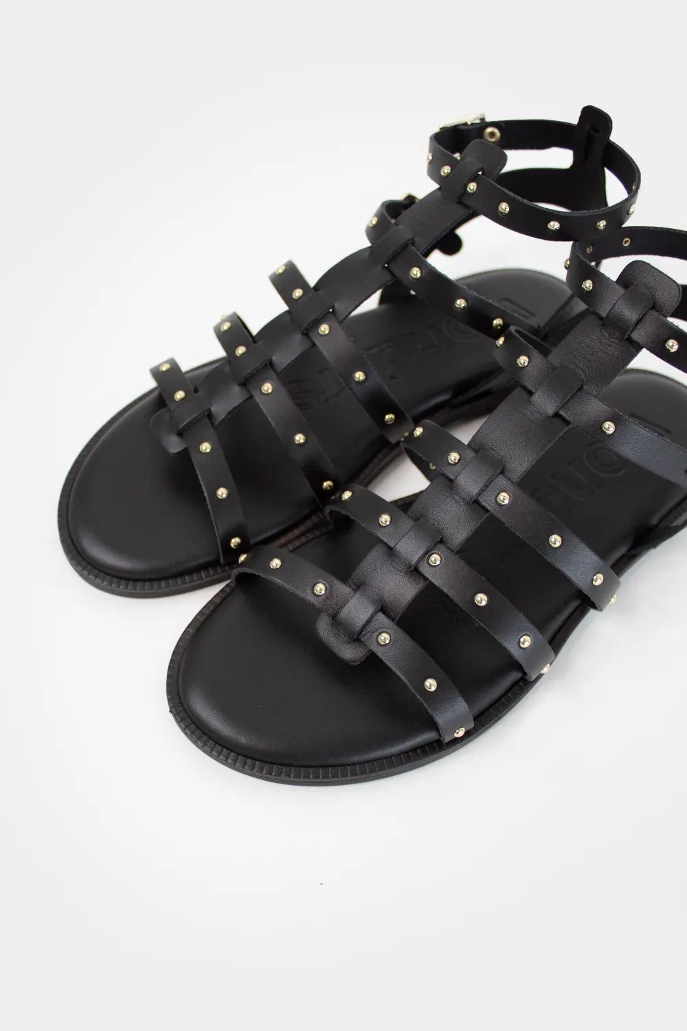 Spanish leather sandals. Black sandals with gold studs and adjustable strap. Cushioned sole.