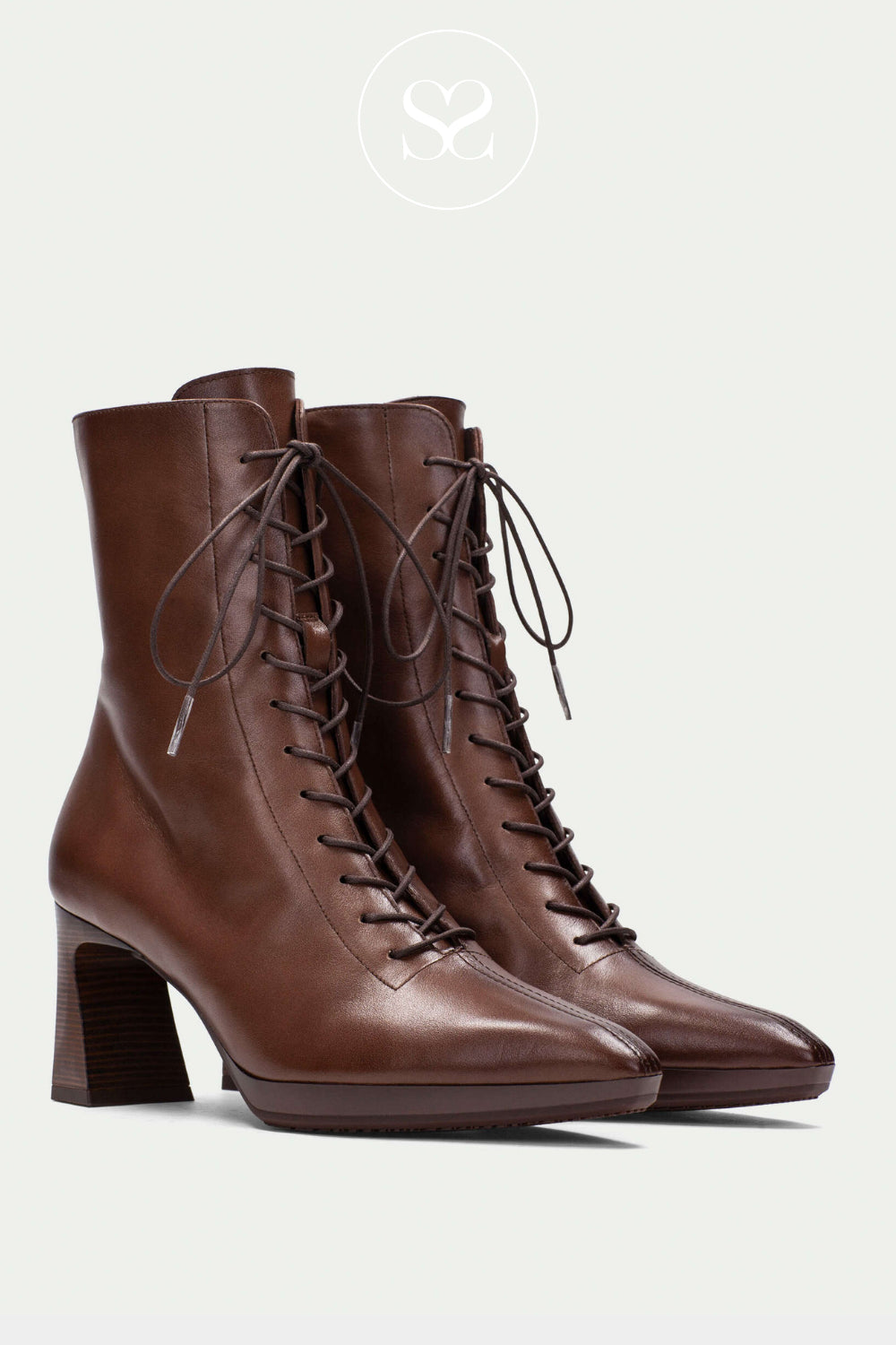 Dark brown leather heeled boots from Hispanitas with pointed toe and lace up front