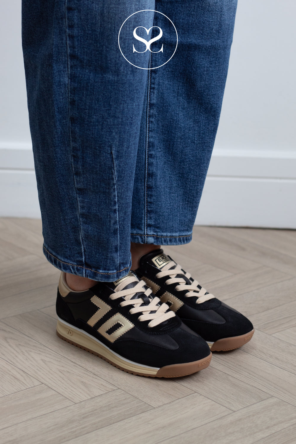 Black nd gold leather trainers for women from Back 70, available in Ireland