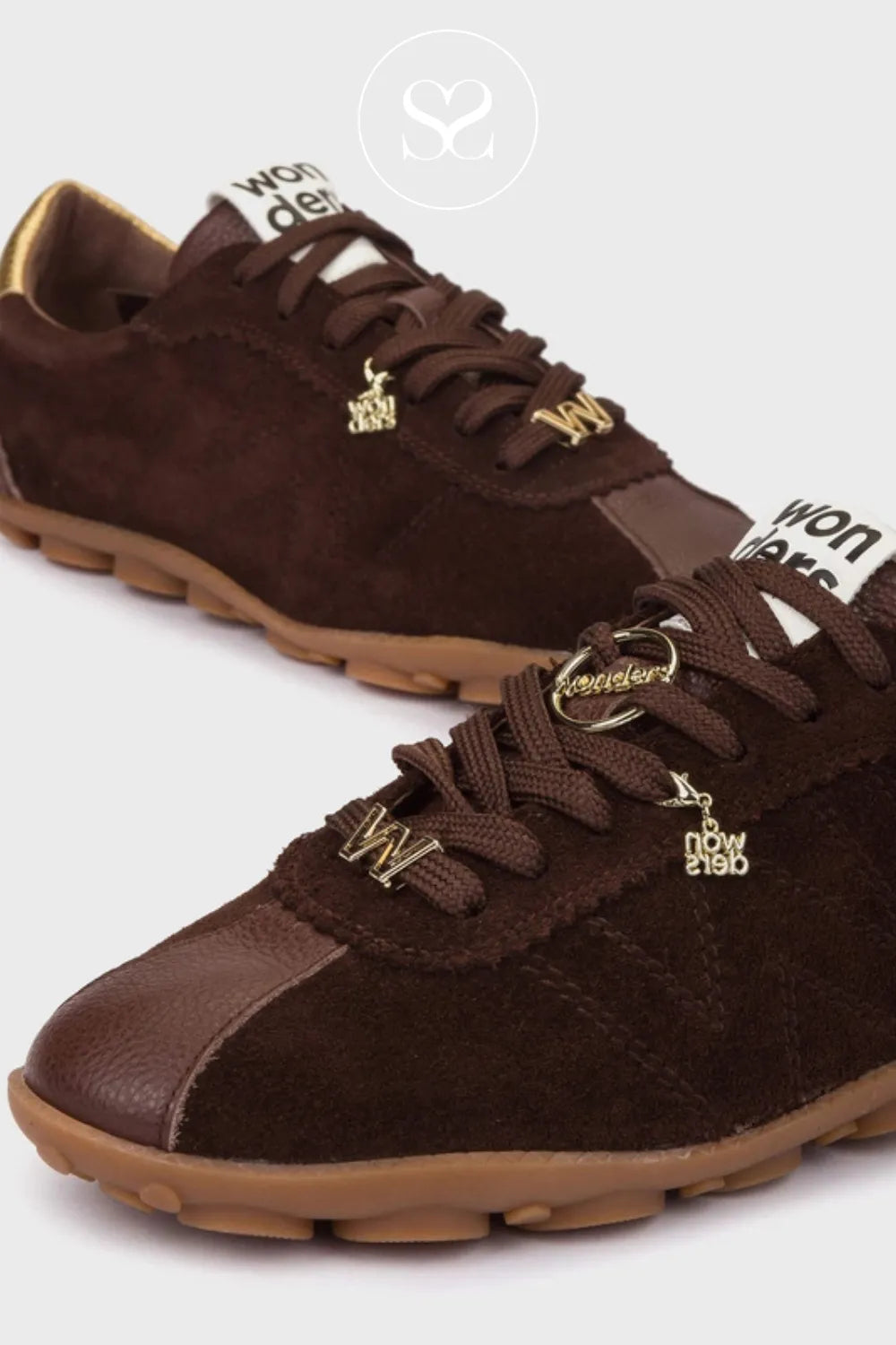 Brown suede sneakers with gold accents on a white background