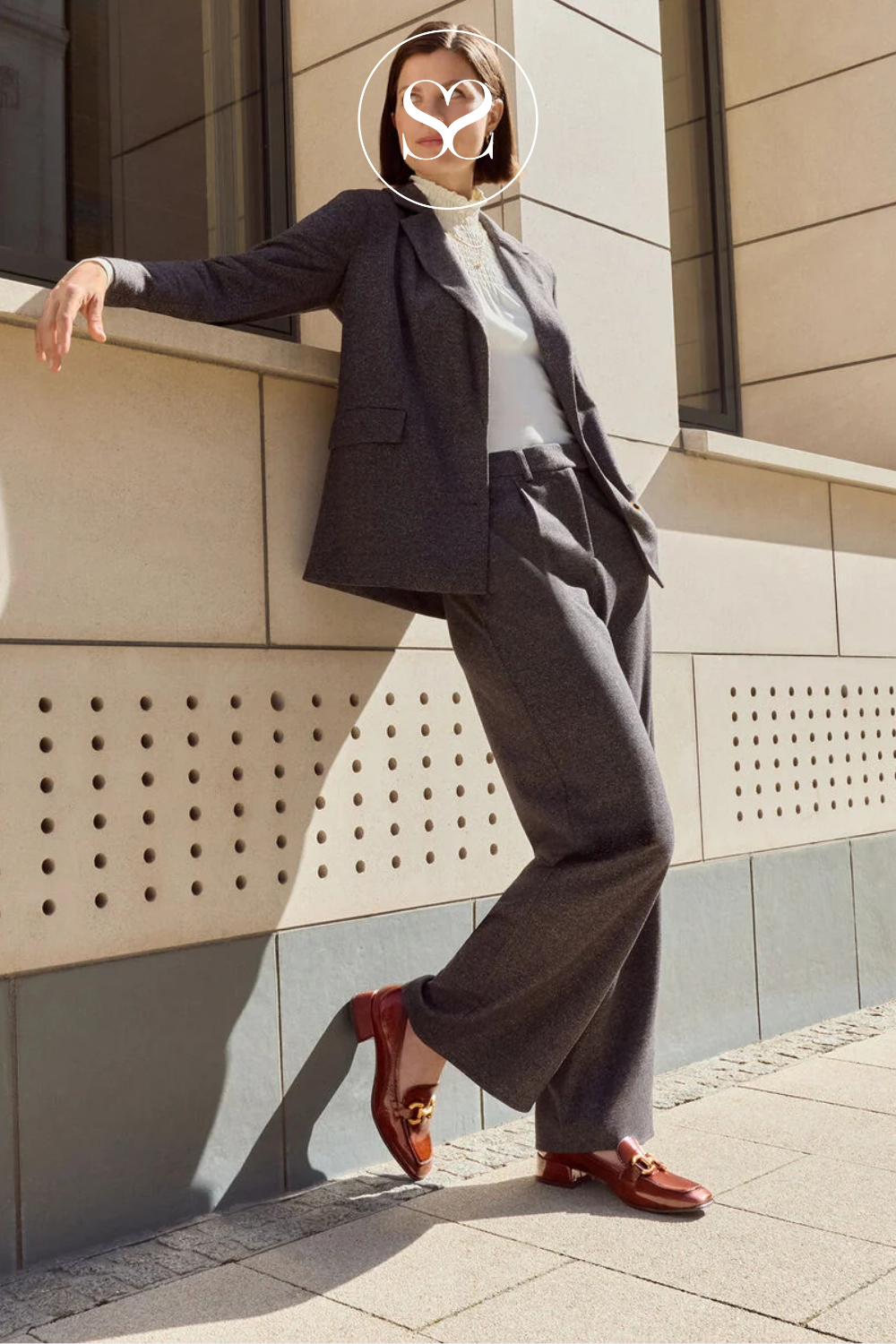 Tamaris tan slip on loafers with mid heel block heels.