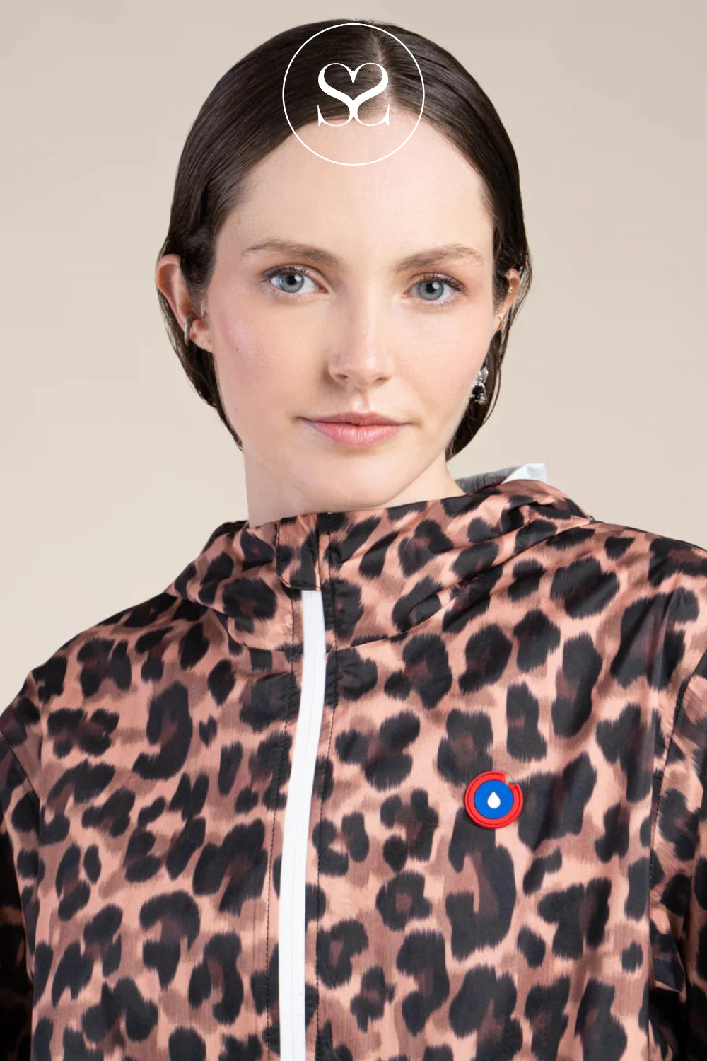 WOMAN WEARING LEOPARD PRINT WATER RESISTANT - SHOWERPROOF JACKET WITH HOOD