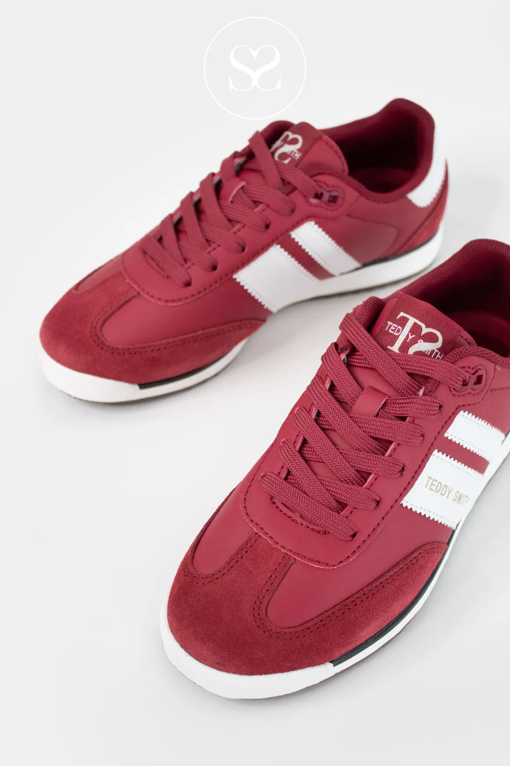 Red sneakers with white accents on a white background from Teddy smith