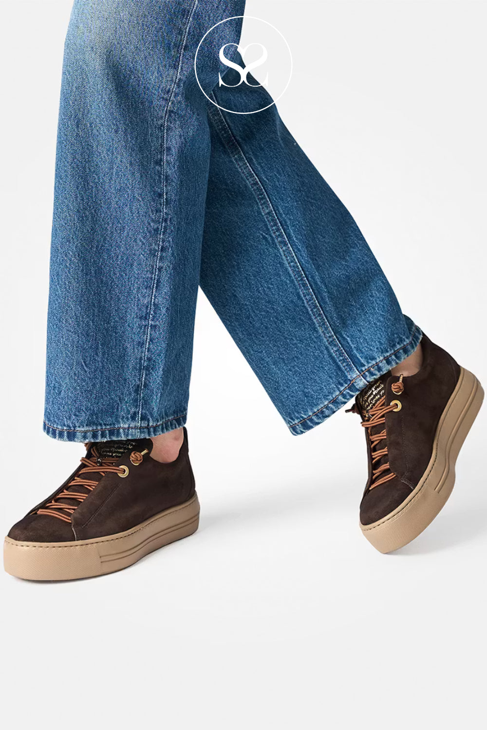 Paul Green Brown sneakers with beige soles worn with blue jeans on a white background