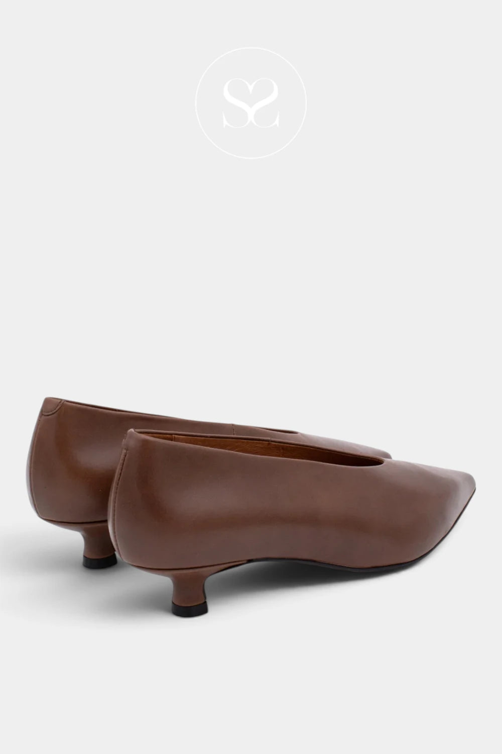 A pair of women's pointed-toe flats in smooth brown leather, styled with low kitten heels, shown from a side angle on a light gray background.