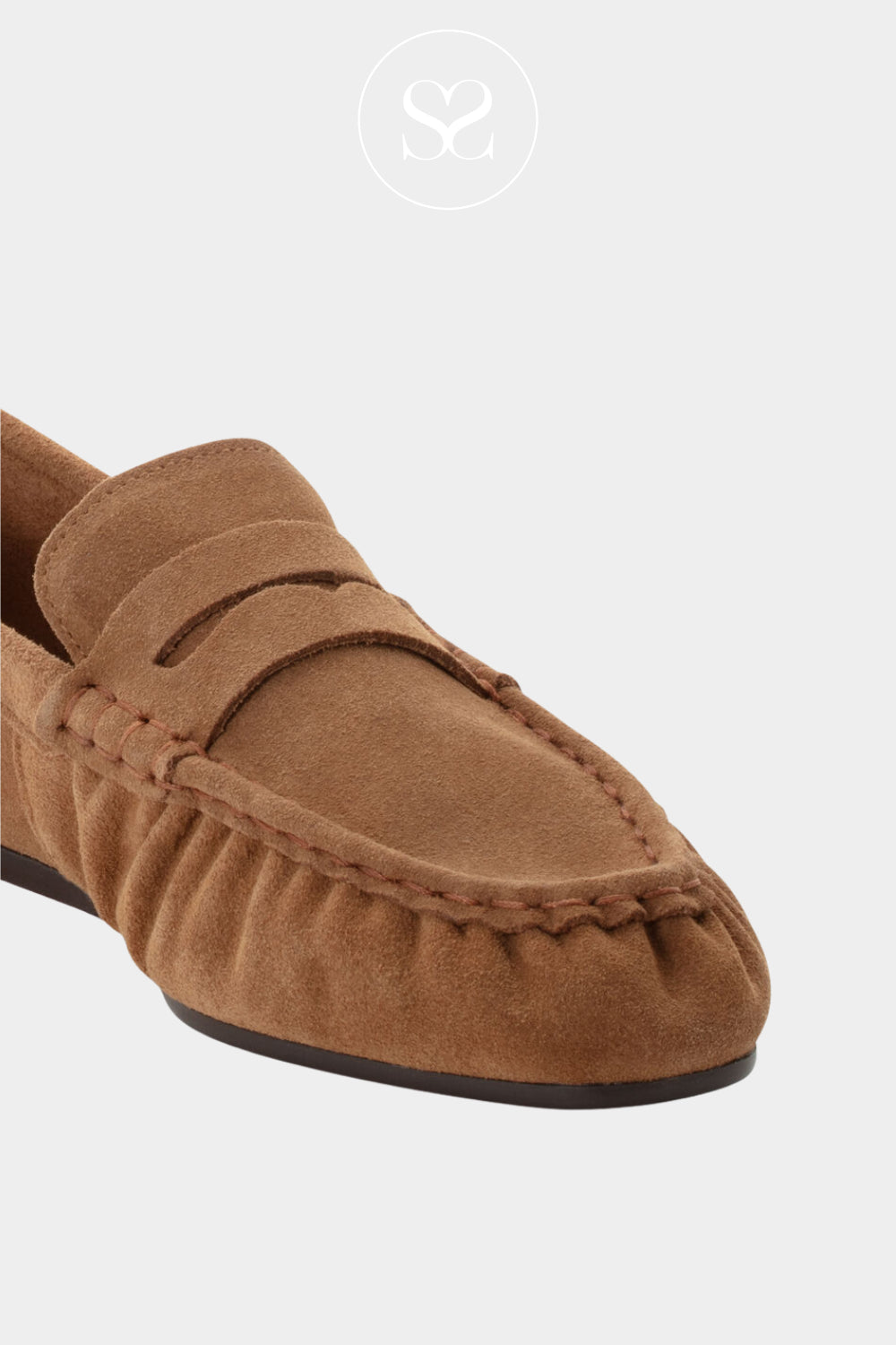 Brown suede loafer shoe with a keyhole design