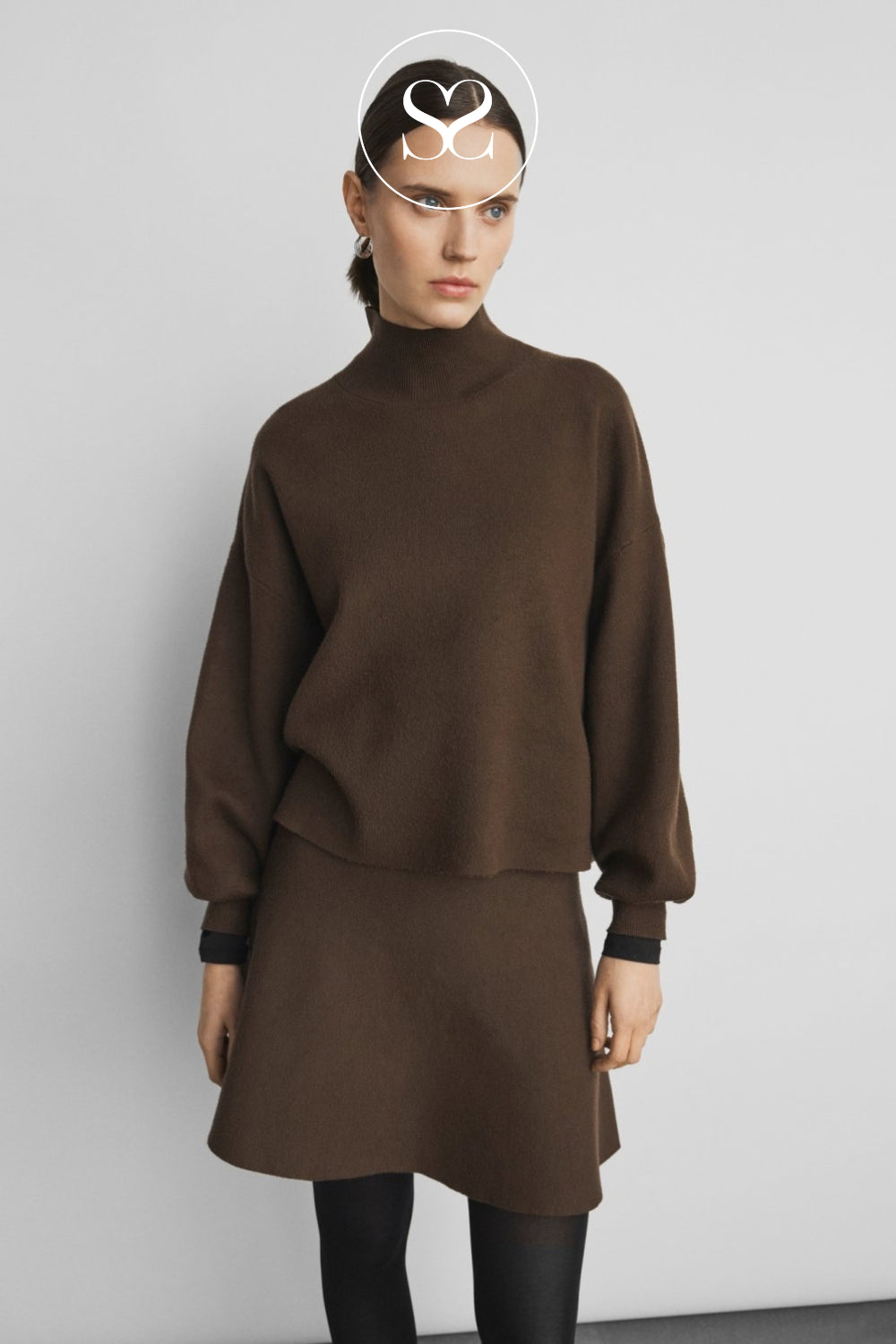 A model wearing a dark brown knit mock-neck sweaterfrom MSCH Copenhagen in Ireland