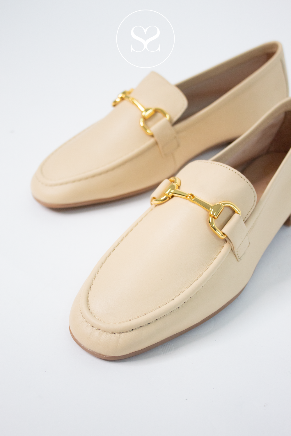 Yellow slip on loafers. Round toe shoes. Soft leather round toe shoes. Gold chain feature.