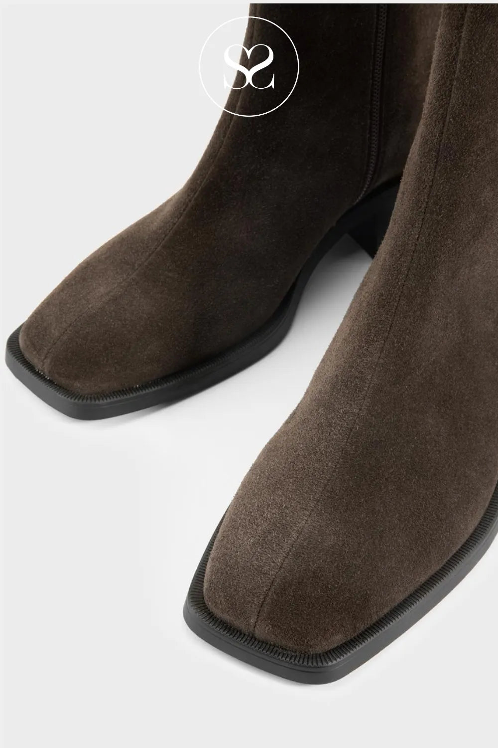 Brown suede Vagabond boots with a square toe on a white background