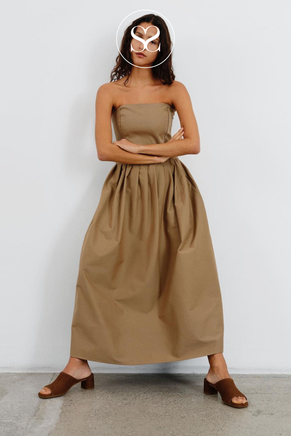 woman wearing Vagabond piper mules in brown suede