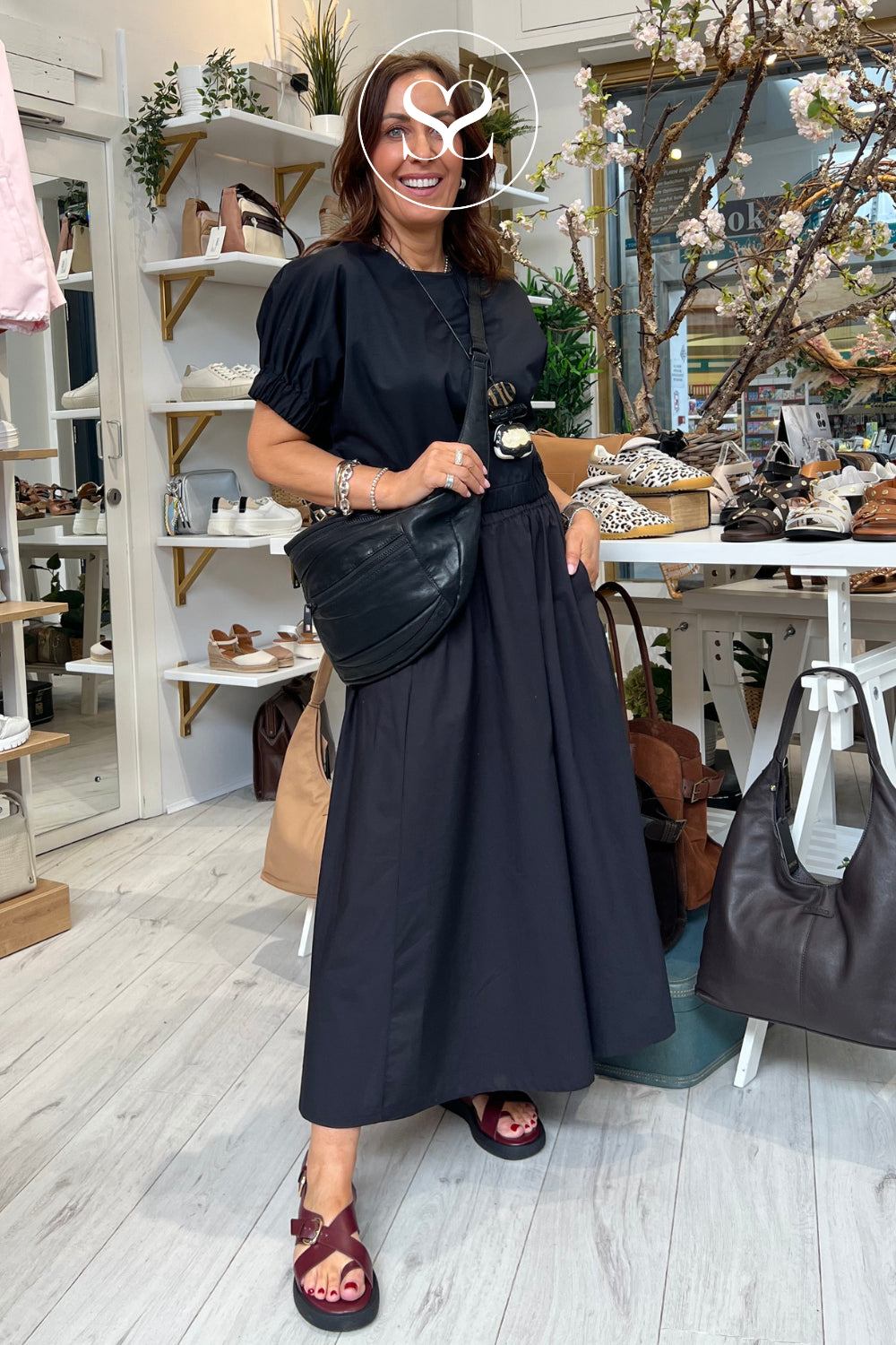 Woman wearing comfortable wine sandals from wonders - flatform cushioned style with toe look and leather straps