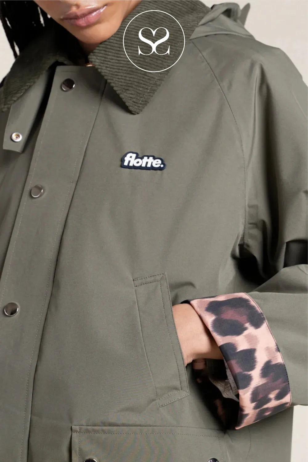 Green jacket with leopard print cuff and 'flotte' logo.