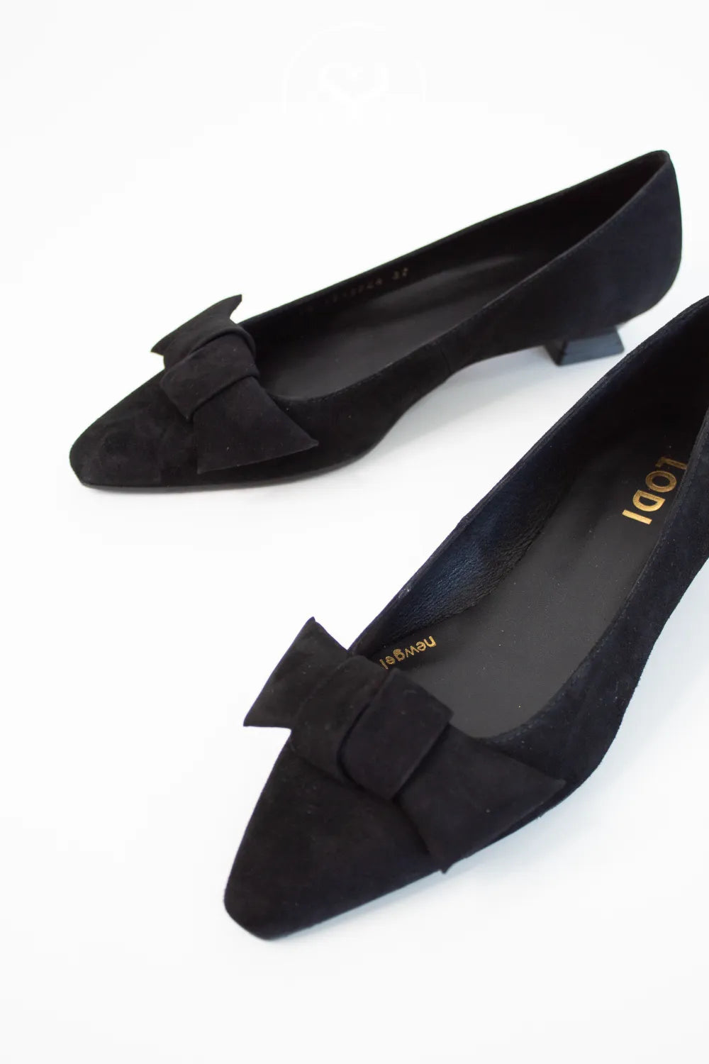 Black suede shoes with bow detail on a white background - Lodi shoes in Ireland BED5527