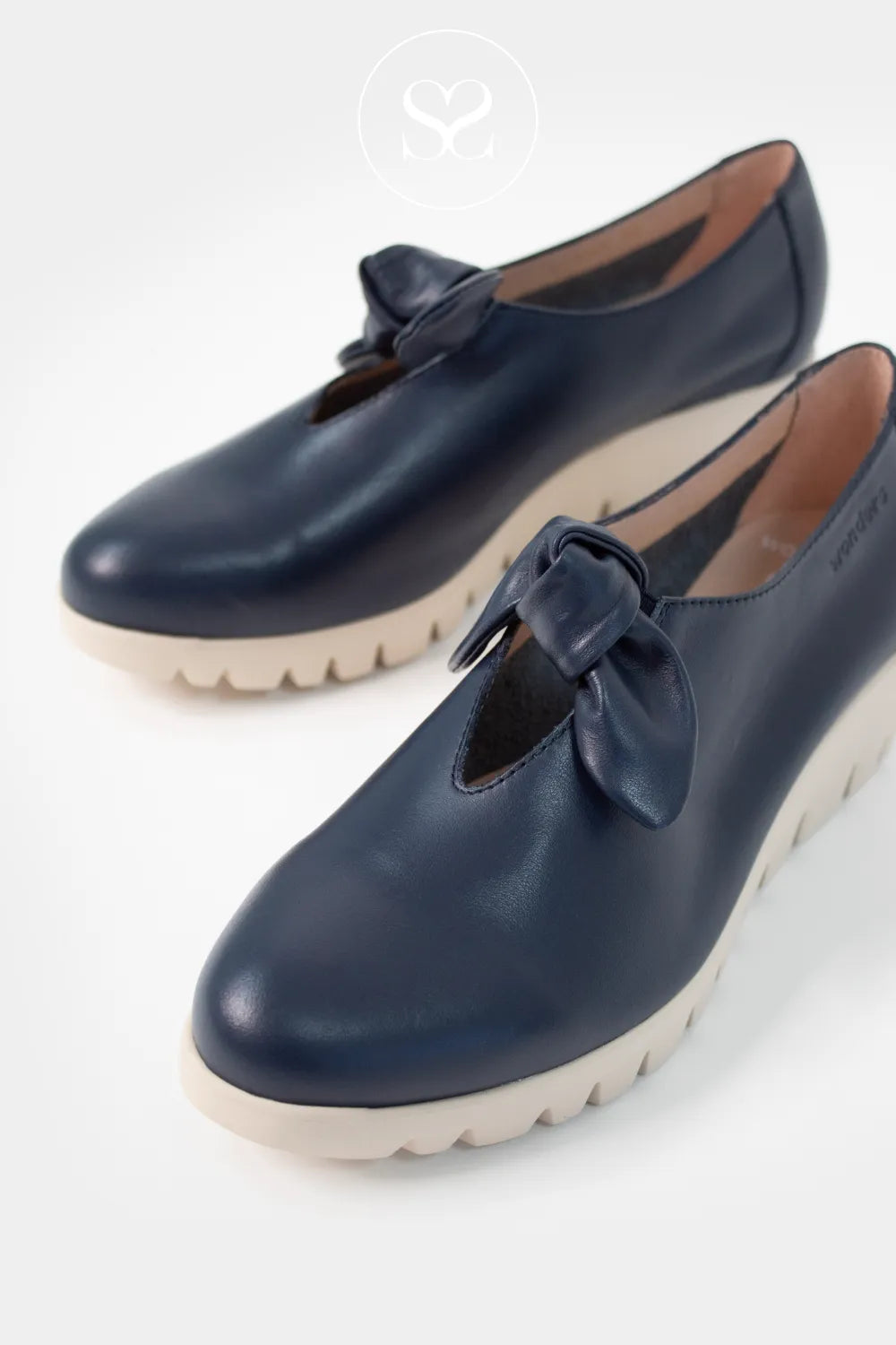 Wonders Navy Wedge Slip-On Shoes C-33159 Rich navy leather finish for a smart, versatile look.