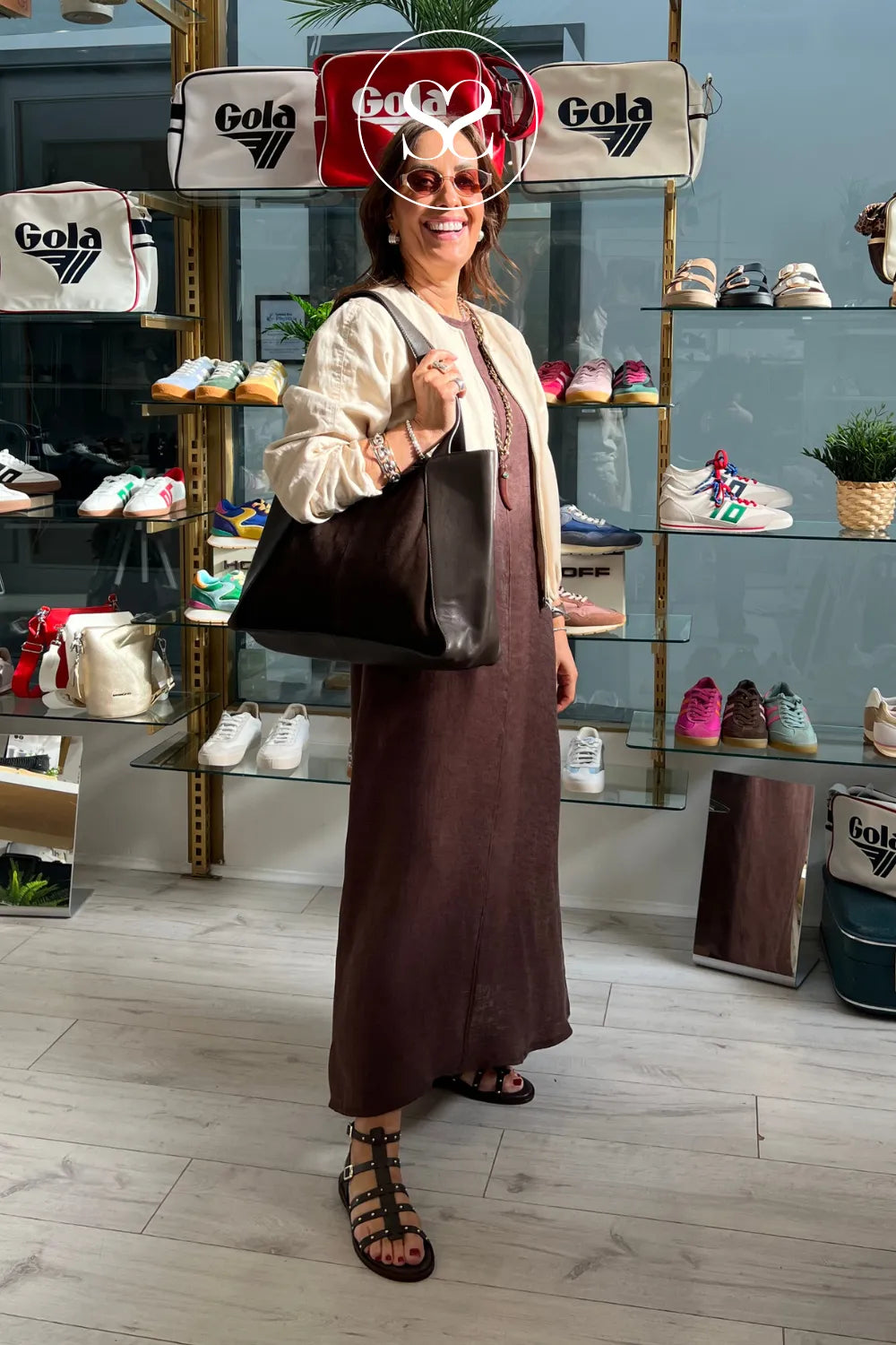 Influencer wearing brown suede Depeche shopper bag