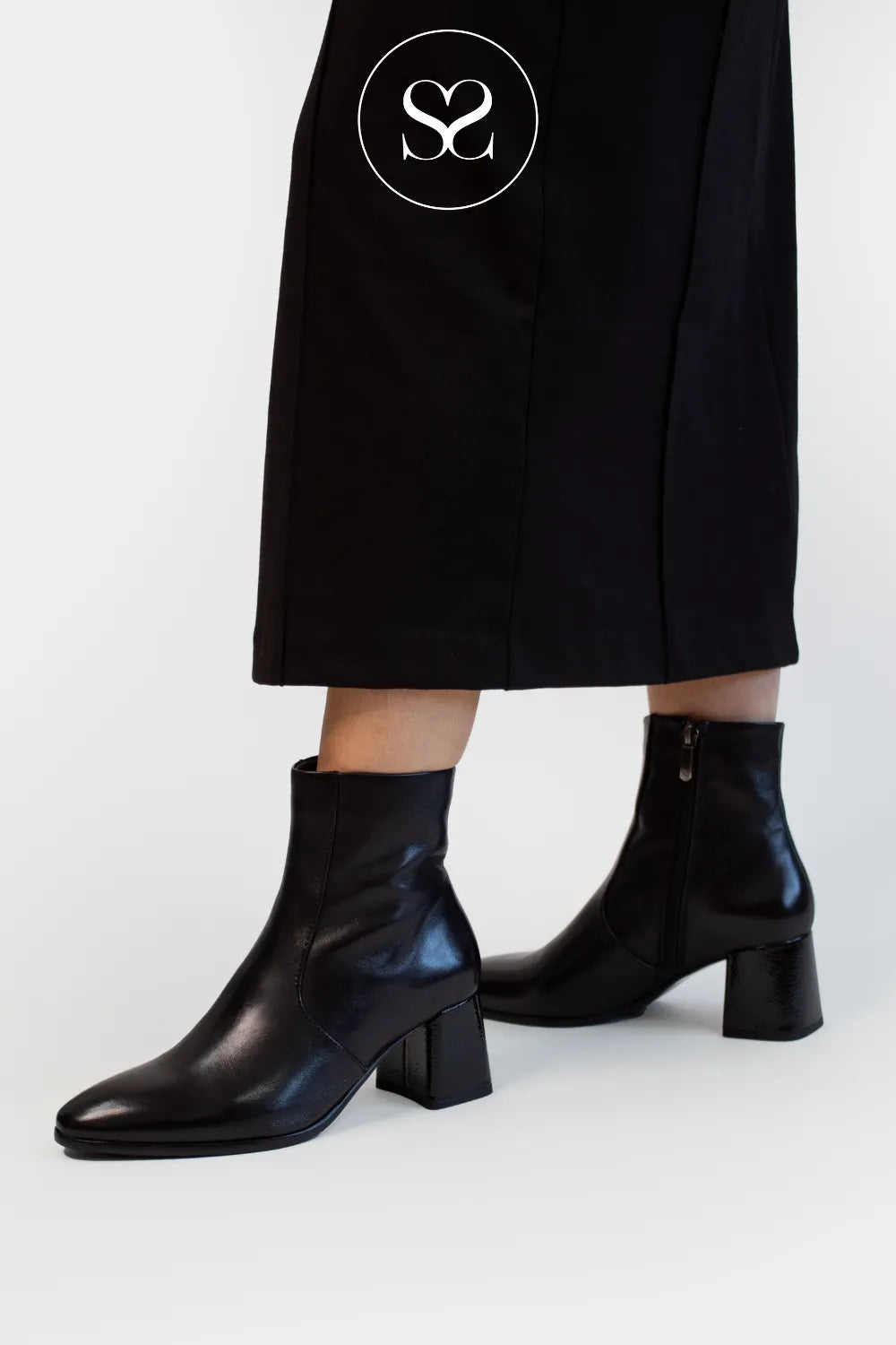 woman wearing regarde le ciel black leather dress boots with comfortable block heel