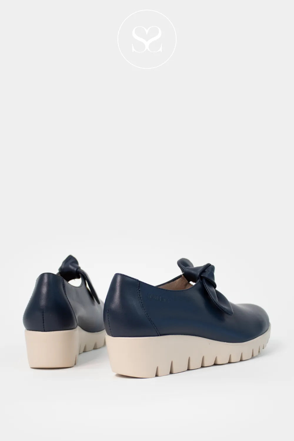 Wonders Navy Wedge Slip-On Shoes C-33159 slip-on style with versatile, neutral tones,