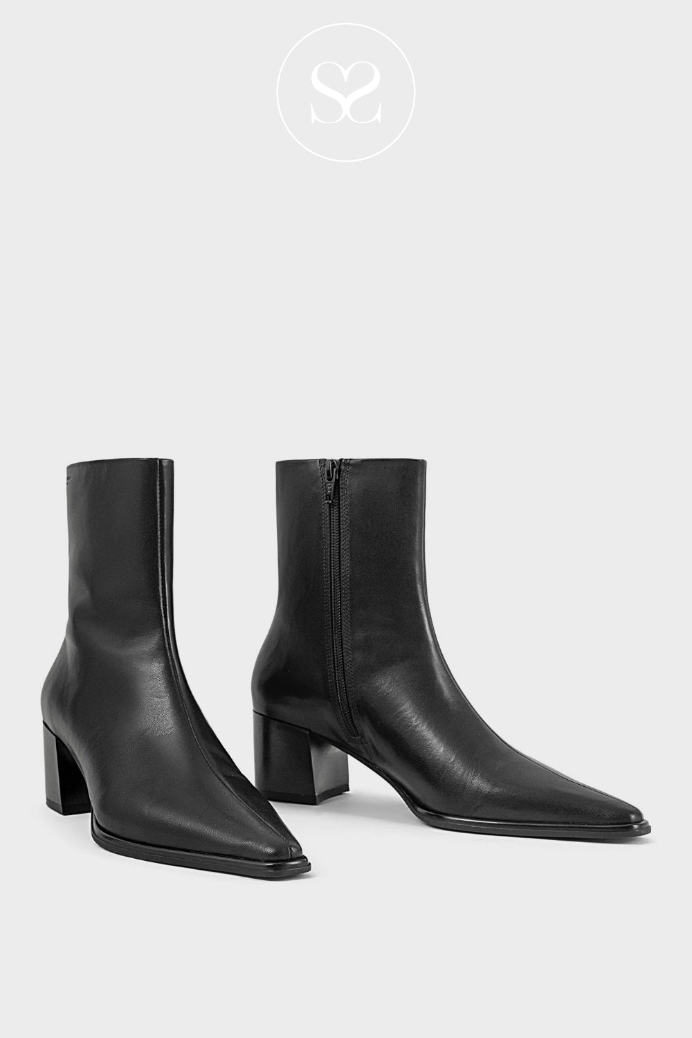 Versatile and stylish: Vagabond Giselle black leather ankle boots, perfect for adding a touch of sophistication to any outfit.
Angle-specific: Vagabond Giselle black leather ankle boots, side view, showcasing the heel height and zip closure.
Material-focused: Premium black leather Vagabond Giselle ankle boots, known for their durability and timeless design.
Related
A close-up of the GISELLE 5654-001 boots showcasing their sleek pointed toe and smooth brown leather finish with subtle stitching details
The