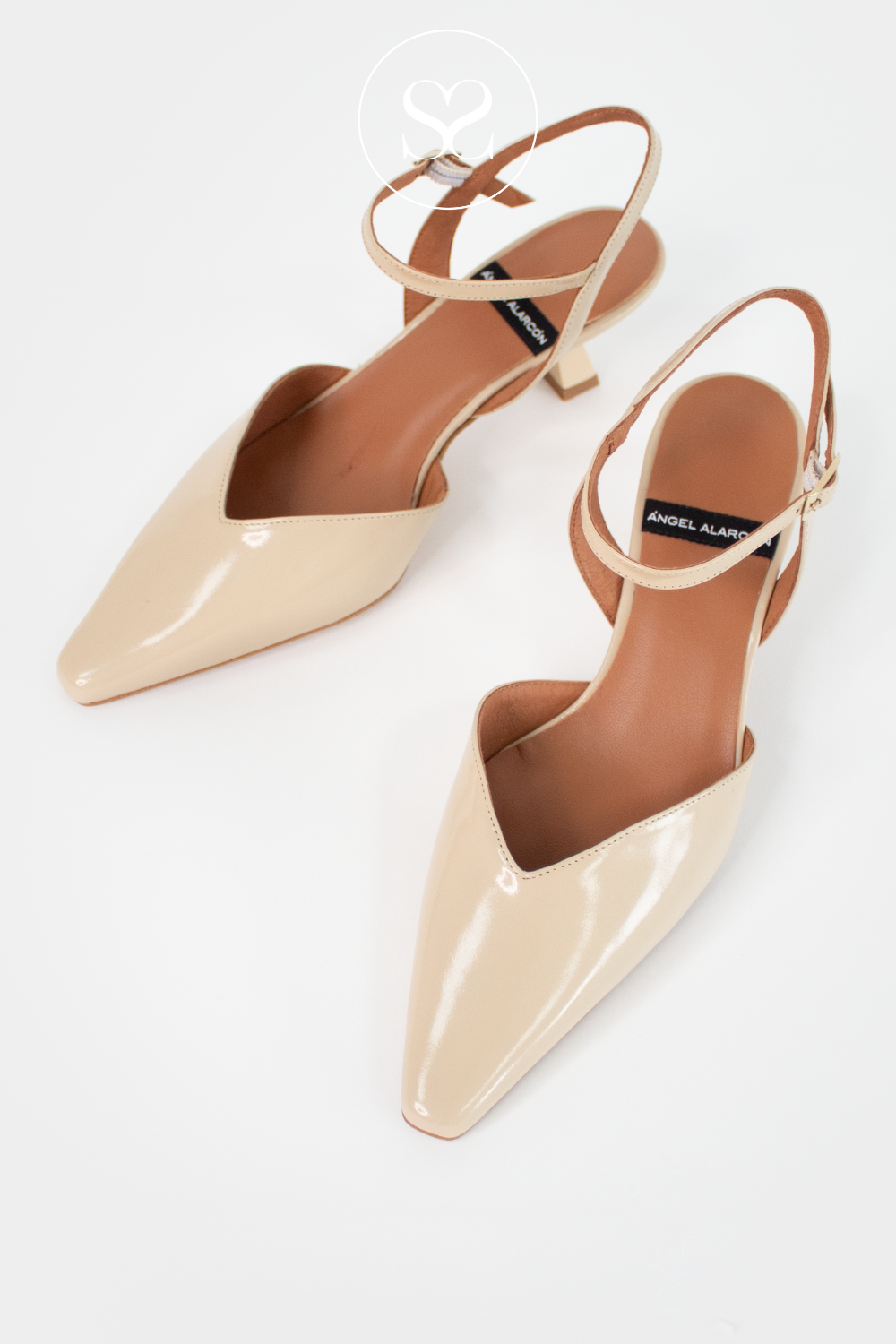 Comfortable neutral kitten heel shoes in beige leather with pointed toe, open back and ankle strap from Angel Alarcon shoes in Ireland