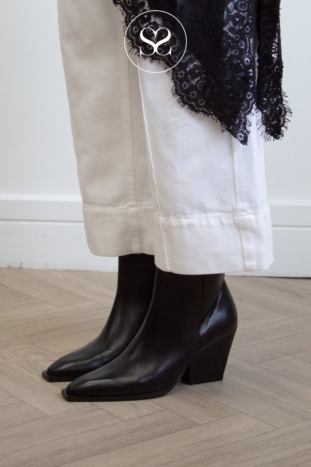 black leather western look ankle boots with cuban heel and pointed toe from Angel Alarcon