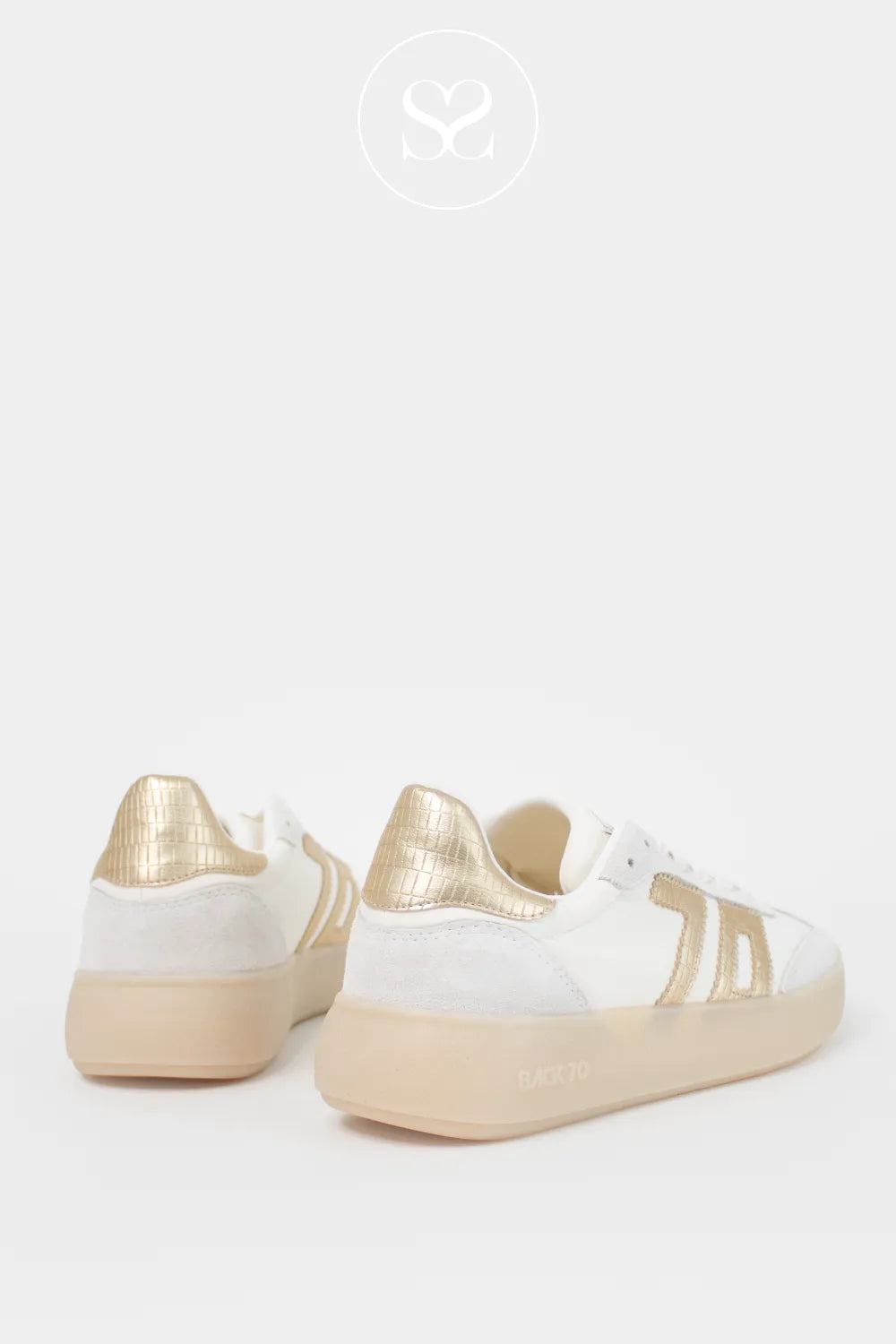 Platform trainers. Chunky soles, laces and gold embellished logo on the side. The perfect summer white trainers.