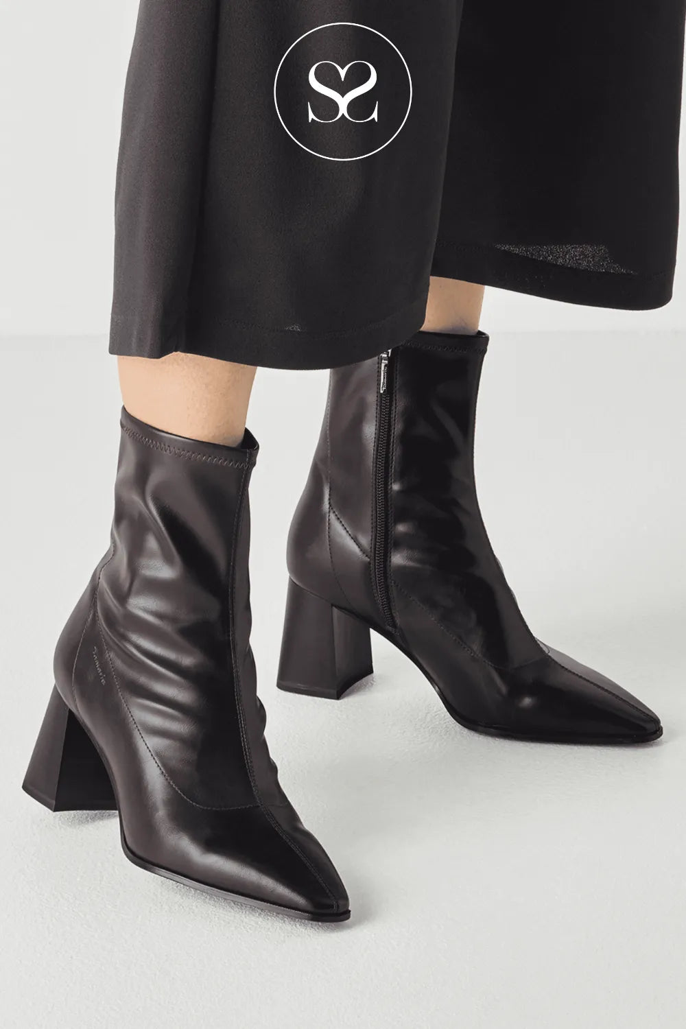 Wine high heeled boots with block heel and pointed toe. Inside zip for easy put on. Versatile comfortable dressy boots.