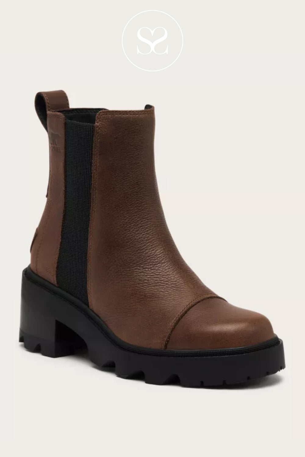 Brown ankle boot with black sole on a white background