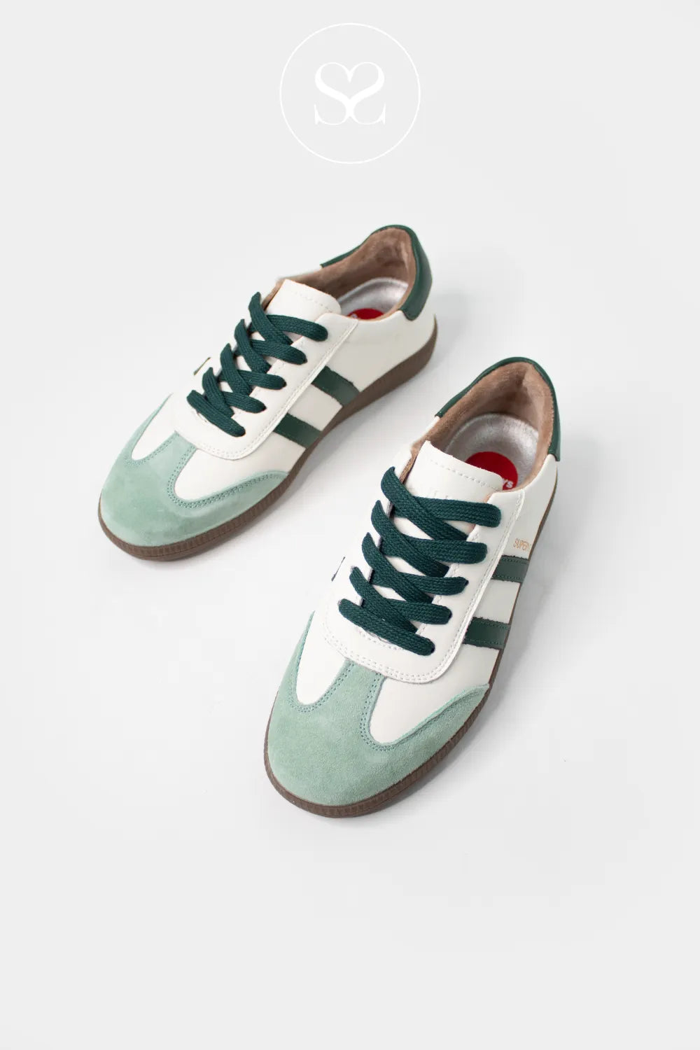 Drilleys White And Green Trainers - Sixty Four With a plush faux fur lining, these trainers ensure warmth and comfort all day long, ideal for cooler weather or year-round wear.