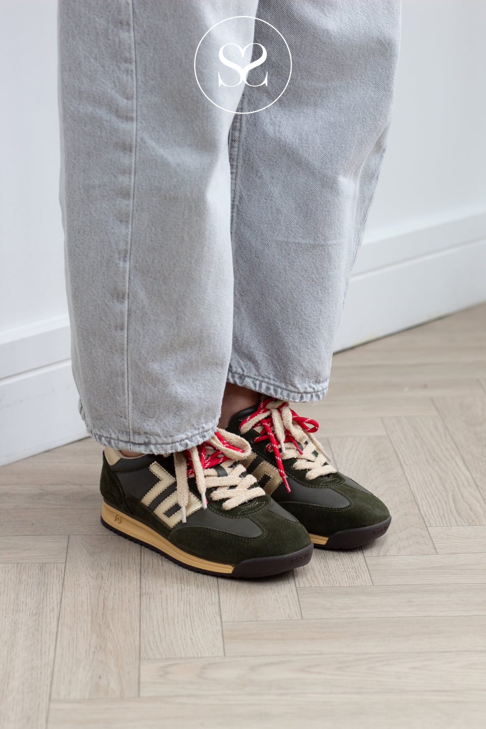 Woman wearing comfortable khaki sneakers from Back 70 with double lace and gold details