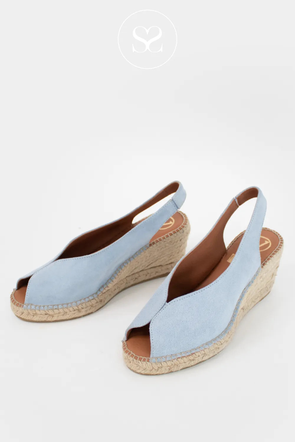 Light blue peep toe wedge sandals. Espadrille sandals with elasticated slingback strap.