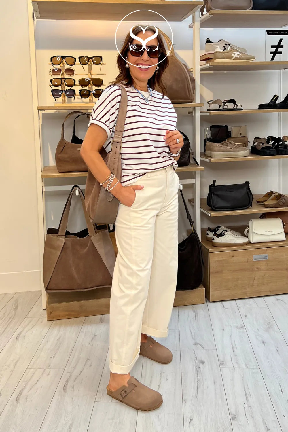 Woman wearing toni pons clog sliders with depeche suede and sunglasses