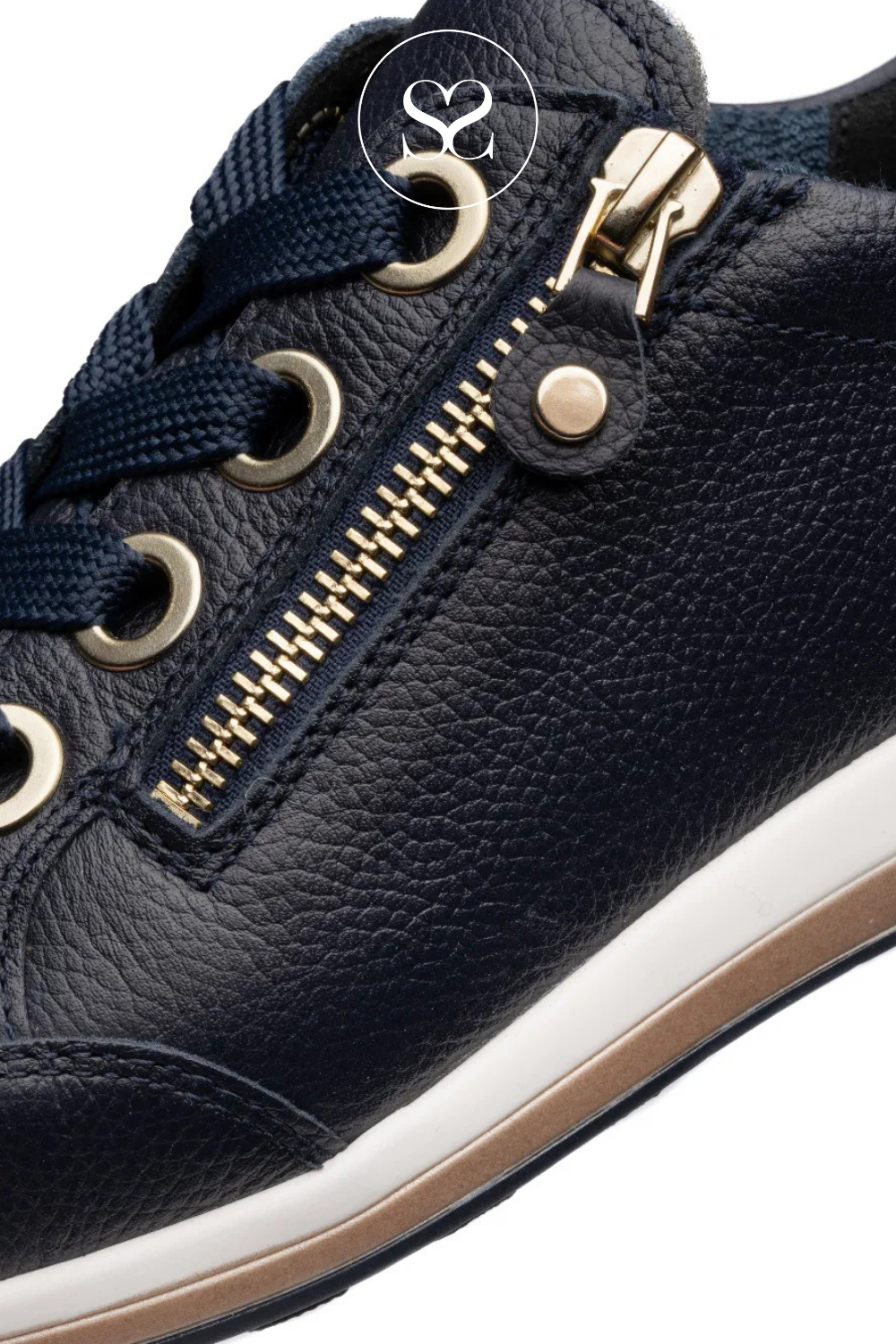 Navy blue sneaker with gold zipper and white sole