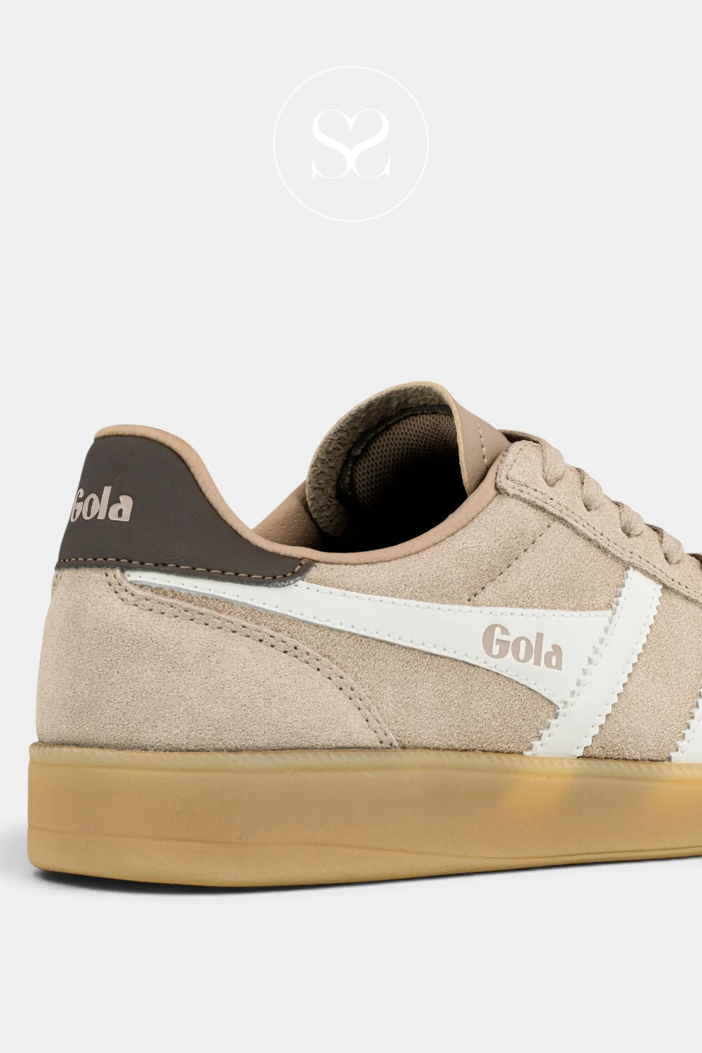 A close-up side view of a Gola sneaker in beige suede with a white side stripe, brown heel tab, and gum sole, set against a light gray background.