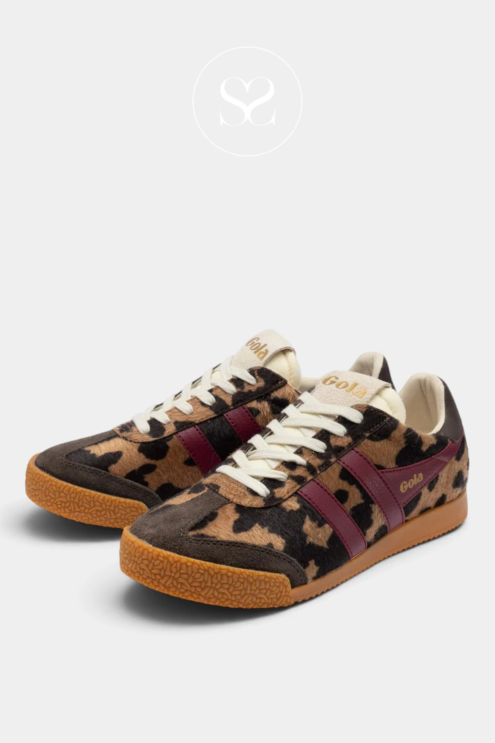 A pair of low-top sneakers featuring a leopard print pattern in brown, beige, and black, with burgundy side stripes, cream laces, and gum soles. The brand name 'golf' is visible on the side of the shoes.