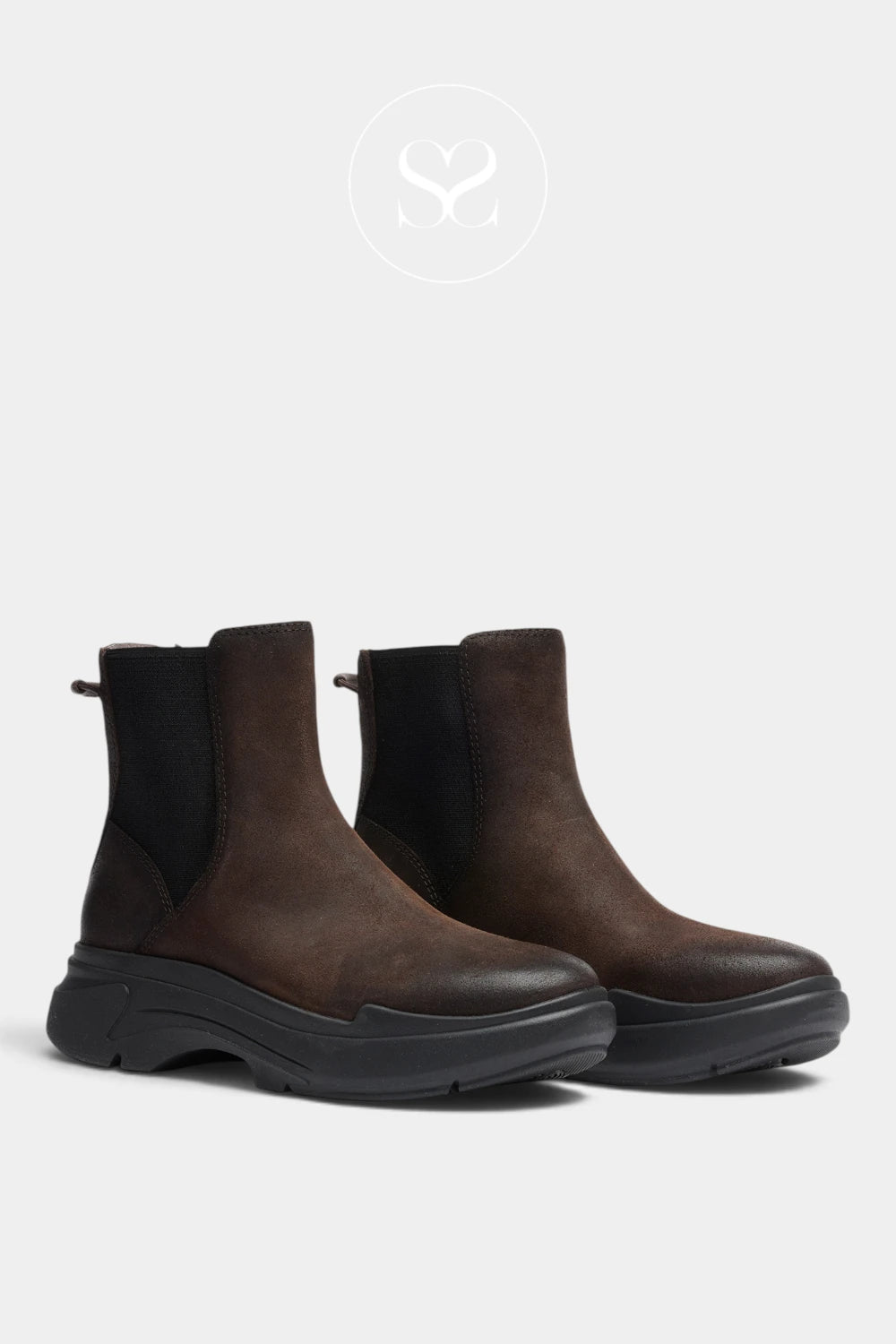 A pair of dark brown leather Chelsea-style ankle boots with black elastic side panels and chunky black soles, shown on a light gray background.