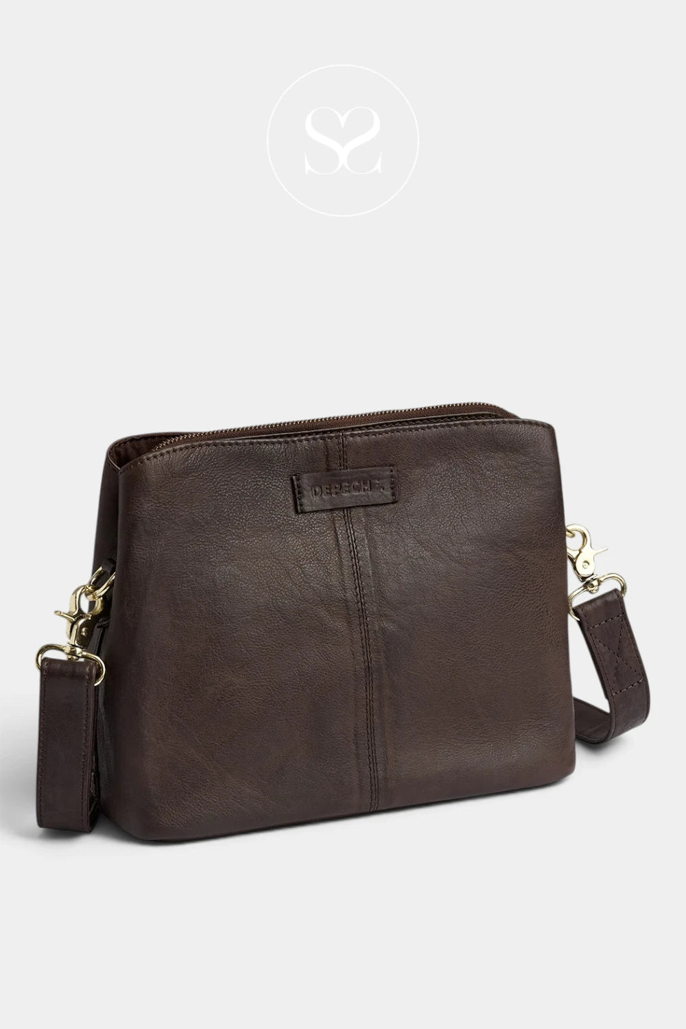 A Depeche dark brown leather crossbody bag with gold-tone hardware, shown from a three-quarter angle on a light gray background.