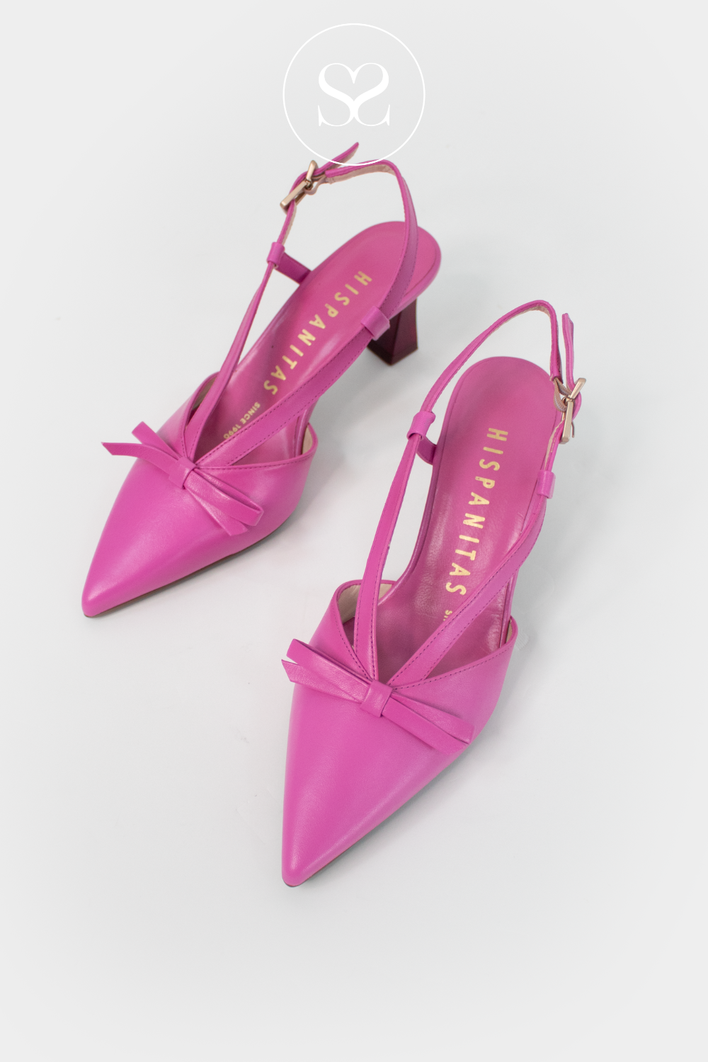 Hispanitas pink pointed toe high heels. Bow feature at front of shoe. Elegant fashion statement shoe. Slingback style, adjustable strap, mid heel, pointed toe, leather partywear shoe.