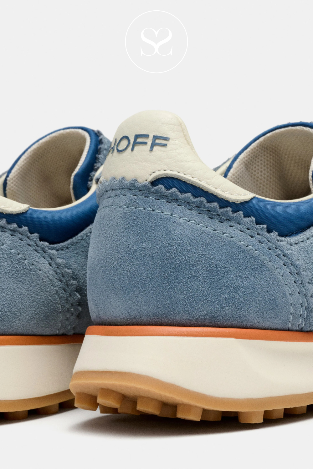 Blue sneakers with Hoff branding on heel cap and tongue. Sporty shoe. Orange laces are the main feature. Gum sole.