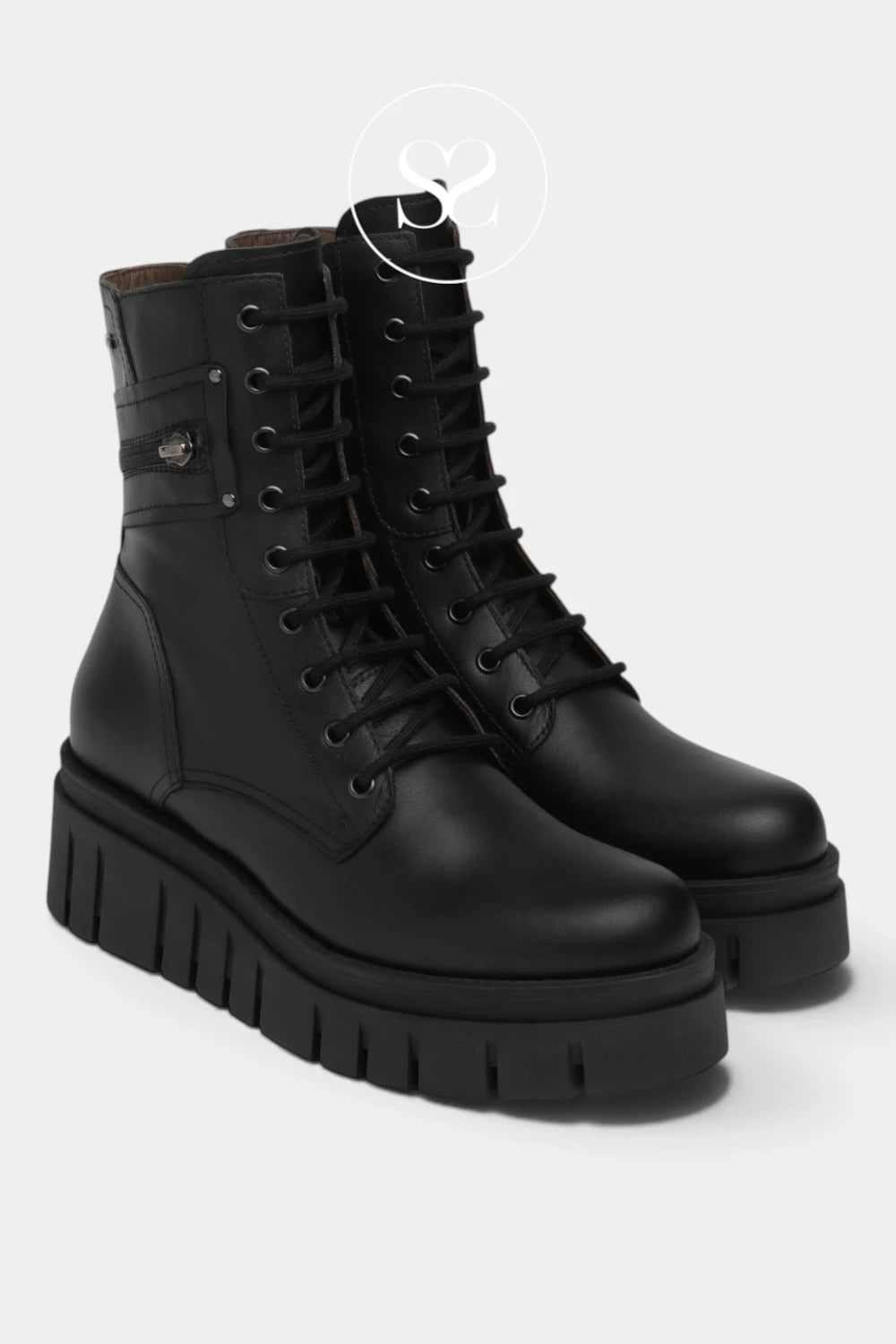 A pair of black leather lace-up ankle boots with chunky lug soles, shown on a light gray background.